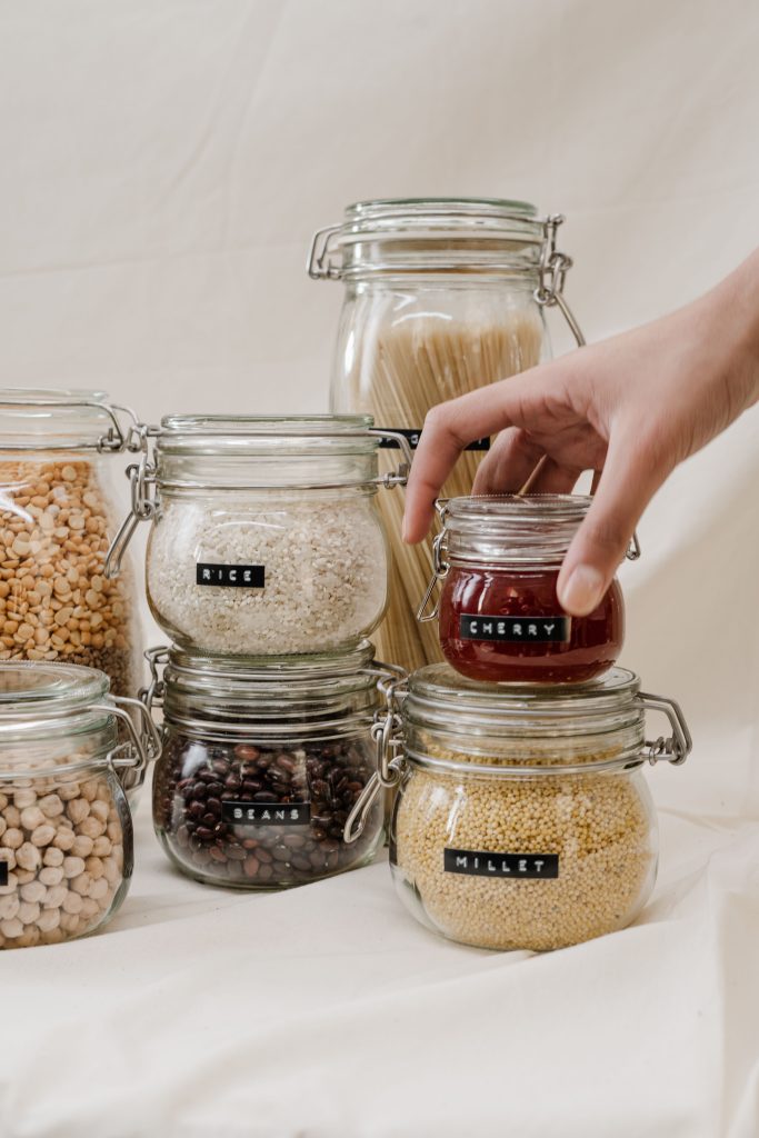 "Glass jars with clamp lids for pantry storage".